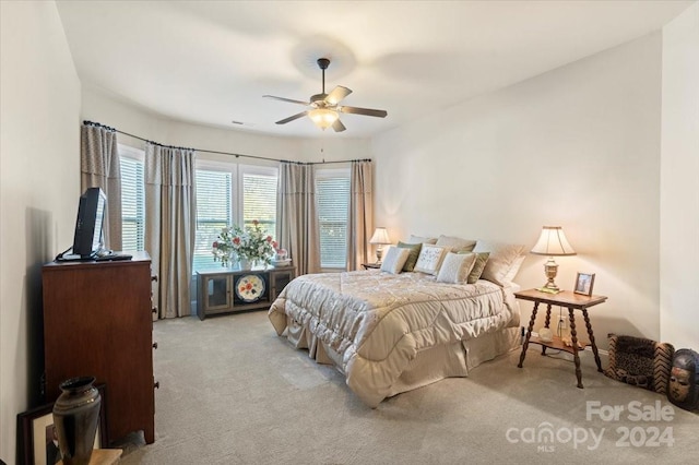 bedroom with light colored carpet and ceiling fan