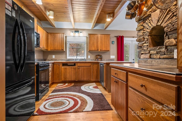 kitchen with beam ceiling, wood ceiling, black appliances, and light wood-type flooring