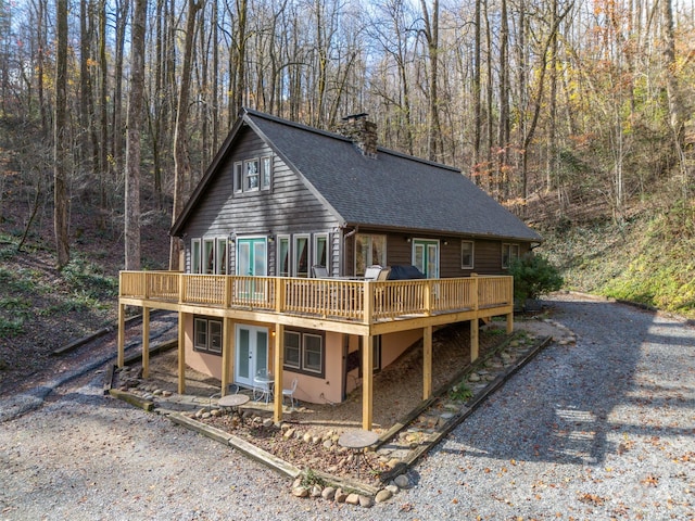 view of front of house featuring french doors and a deck