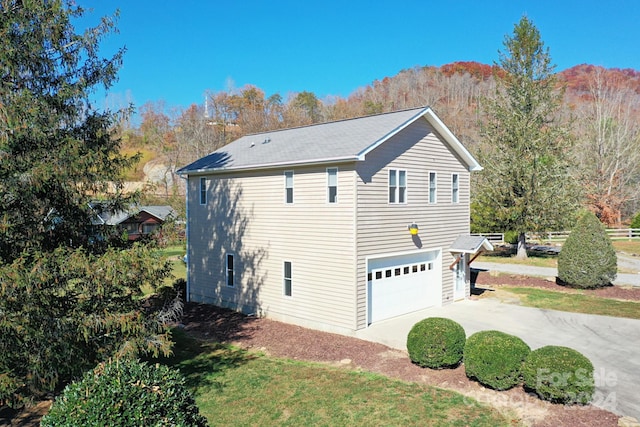 view of property exterior featuring a garage