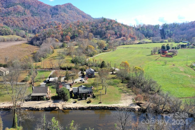 birds eye view of property with a rural view and a water and mountain view