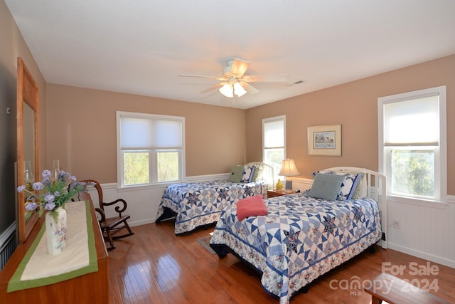 bedroom with ceiling fan and wood-type flooring