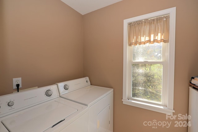 clothes washing area with washer and dryer