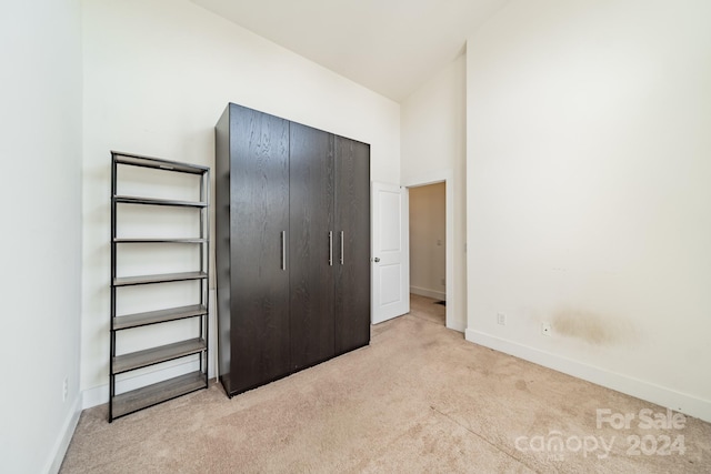 unfurnished bedroom with light colored carpet