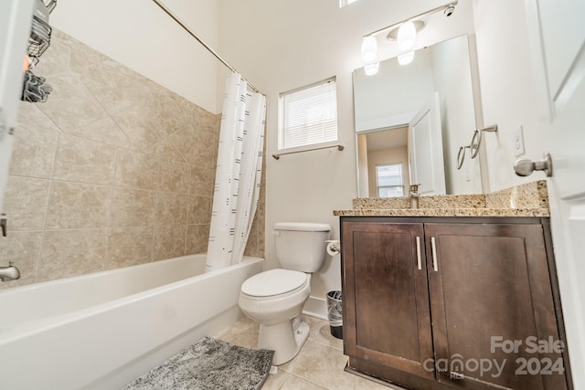 full bathroom with toilet, vanity, tile patterned floors, and shower / bath combo with shower curtain