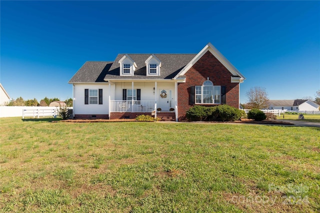 view of front of home featuring a porch and a front lawn