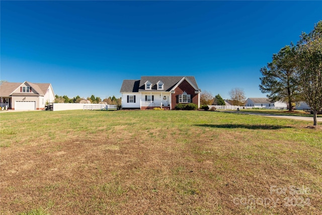 new england style home with a front lawn