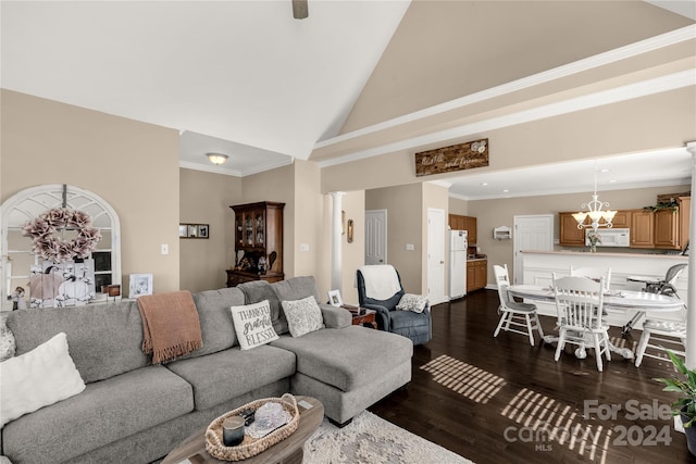 living room featuring crown molding, dark wood-type flooring, high vaulted ceiling, and a chandelier