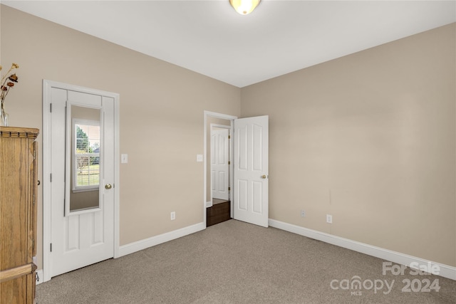 unfurnished bedroom with carpet flooring