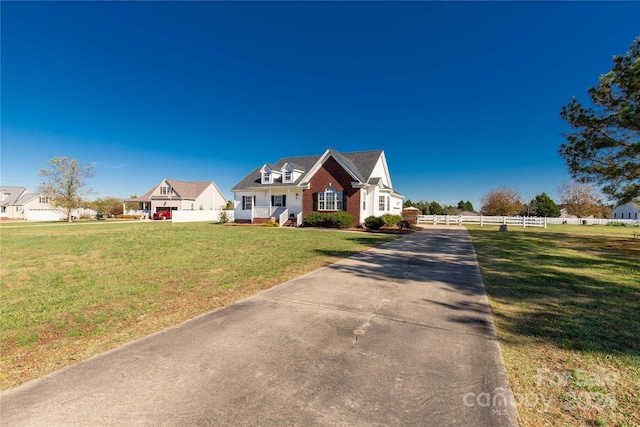 new england style home with a front yard