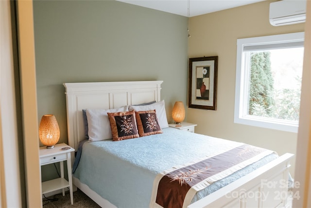 carpeted bedroom featuring a wall mounted air conditioner