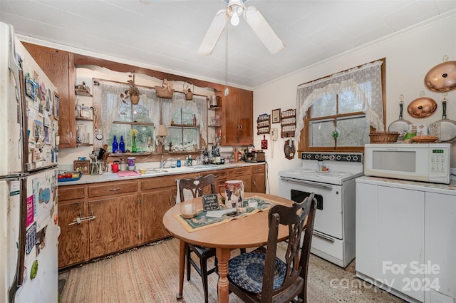 kitchen featuring ceiling fan, white appliances, and ornamental molding