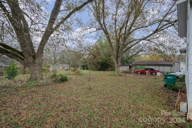 view of yard with a carport