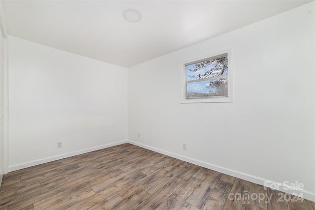 unfurnished room featuring hardwood / wood-style floors