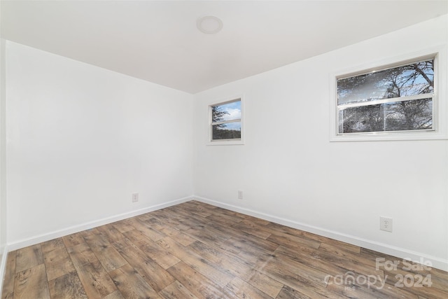 spare room featuring hardwood / wood-style flooring