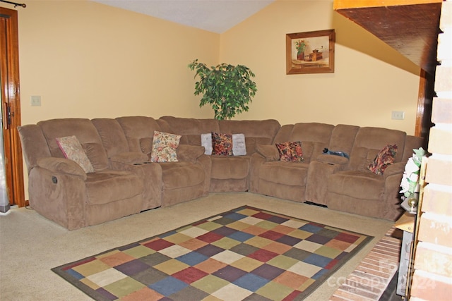 living room with carpet and vaulted ceiling