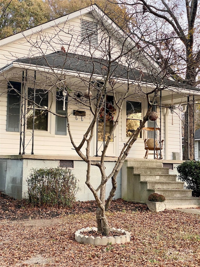 view of home's exterior featuring covered porch