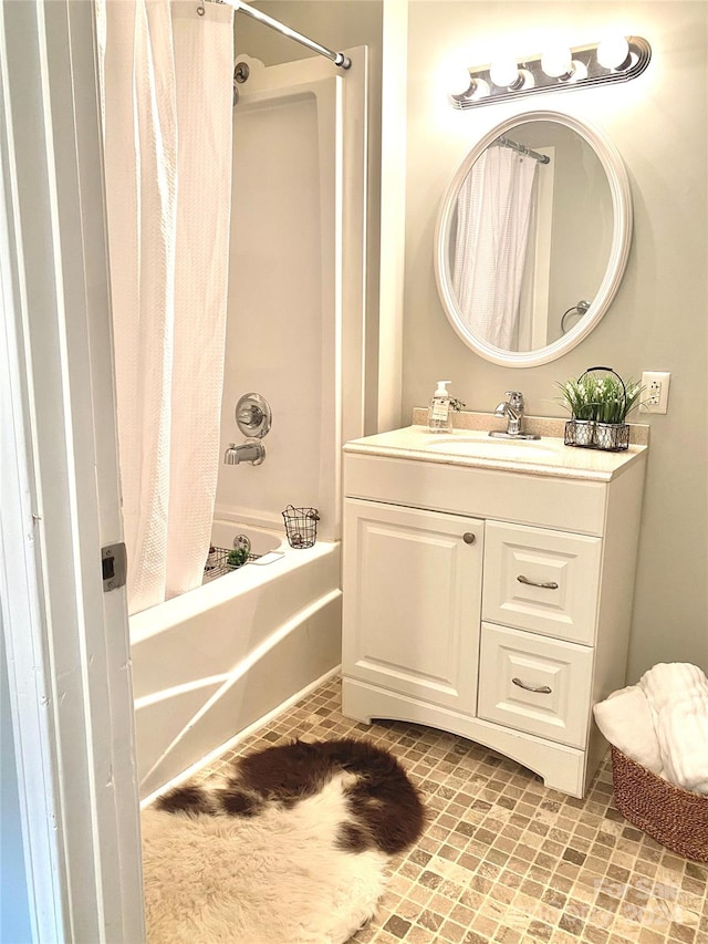 bathroom with vanity and shower / bath combo