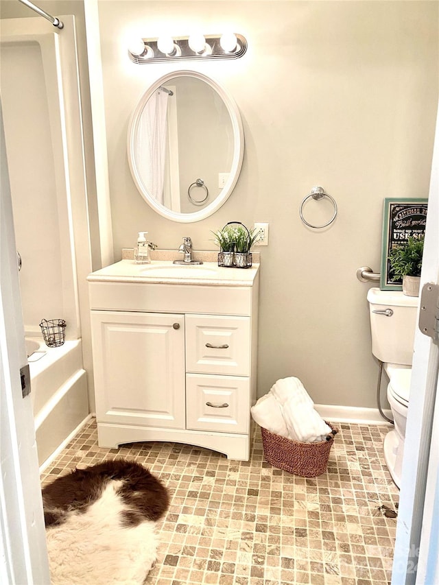 full bathroom featuring vanity,  shower combination, and toilet