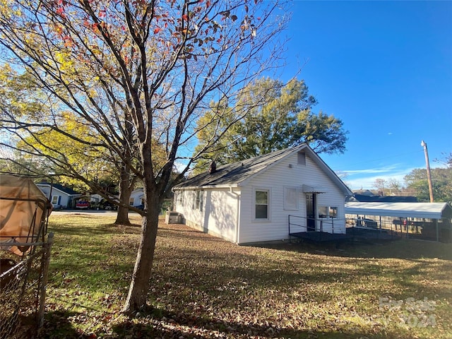 view of property exterior with a lawn