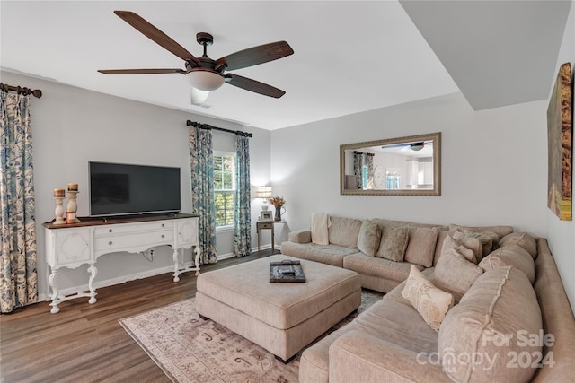 living room with ceiling fan and wood-type flooring