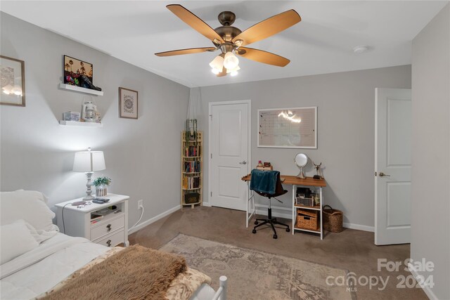 bedroom featuring light colored carpet and ceiling fan