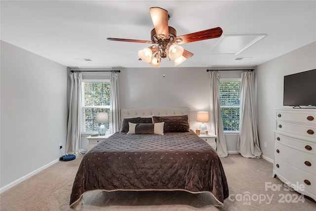 carpeted bedroom featuring ceiling fan