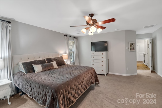 bedroom featuring ceiling fan and light colored carpet