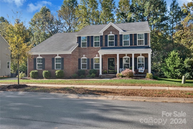 2559 Cypress Oak Ln, Gastonia, NC 28056 - view of front of property featuring brick siding and a porch