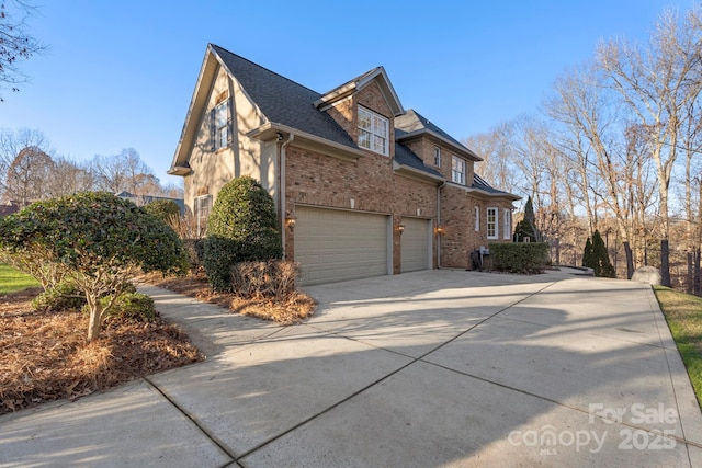 view of side of property with a garage