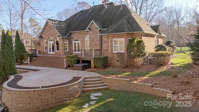 back of house featuring french doors, a patio, and a deck