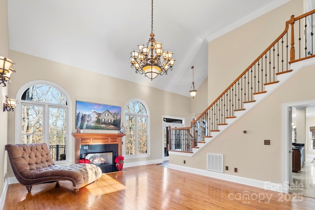 foyer entrance featuring hardwood / wood-style floors and an inviting chandelier