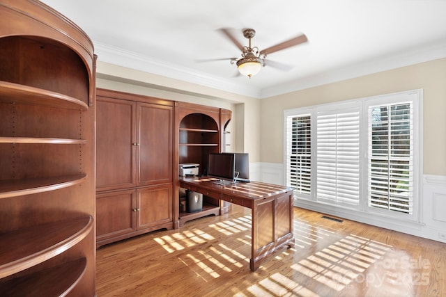 office with light hardwood / wood-style flooring, ceiling fan, and crown molding