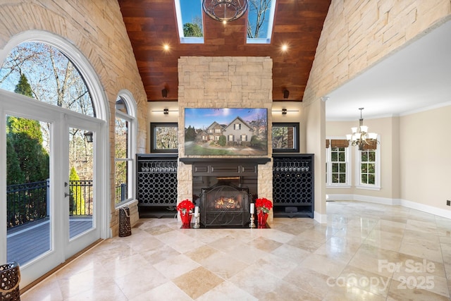 living room featuring a fireplace, high vaulted ceiling, wooden ceiling, and a notable chandelier