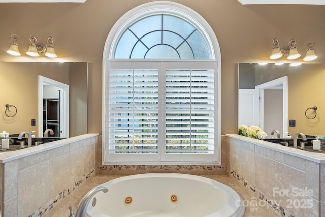 bathroom with tiled bath and sink