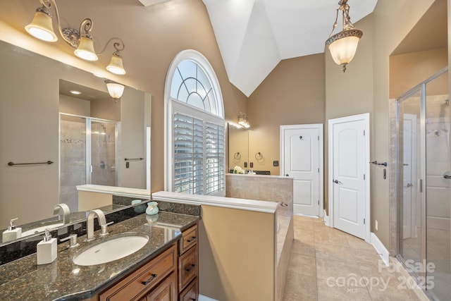 bathroom featuring tile patterned flooring, vanity, a shower with door, and high vaulted ceiling