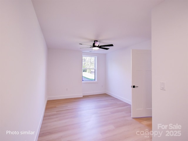 unfurnished room with ceiling fan and light hardwood / wood-style floors