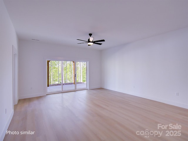 empty room with ceiling fan and light hardwood / wood-style floors