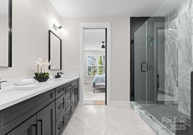 bathroom featuring vanity and a shower with door