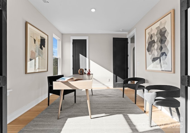 office area with wood-type flooring