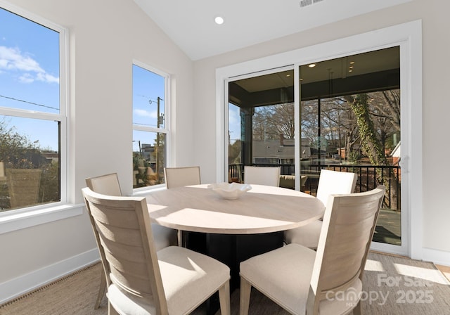 dining area featuring lofted ceiling