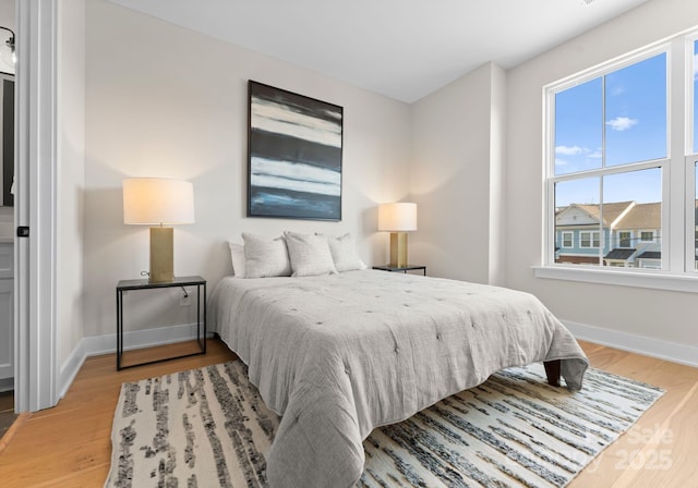 bedroom featuring wood-type flooring