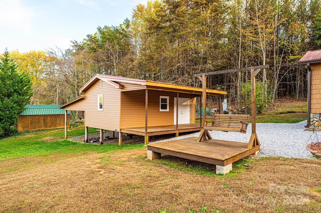 exterior space with a lawn and a deck