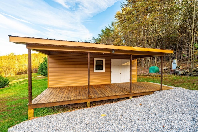 exterior space with a lawn and a wooden deck