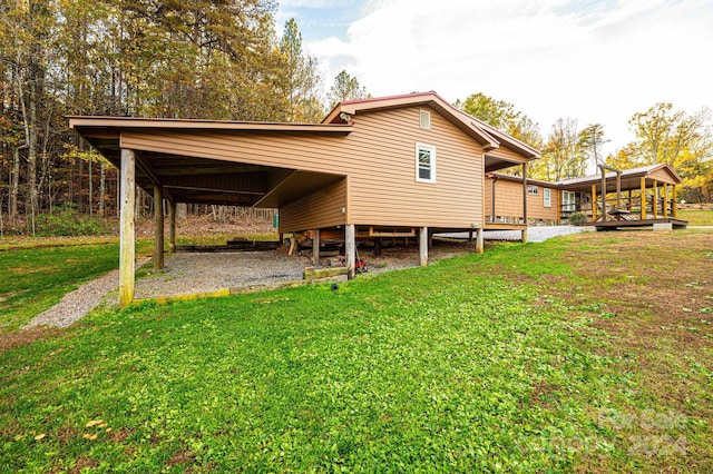 back of house with a lawn