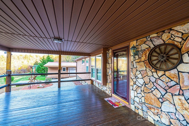 wooden terrace featuring covered porch