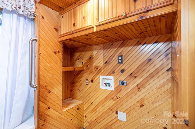 laundry room with wood walls, cabinets, washer hookup, hookup for an electric dryer, and wood ceiling