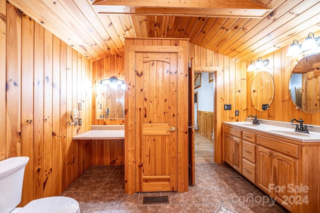 bathroom featuring tile patterned floors, vaulted ceiling with beams, wood walls, and wood ceiling