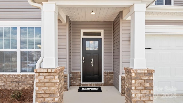 doorway to property featuring a garage