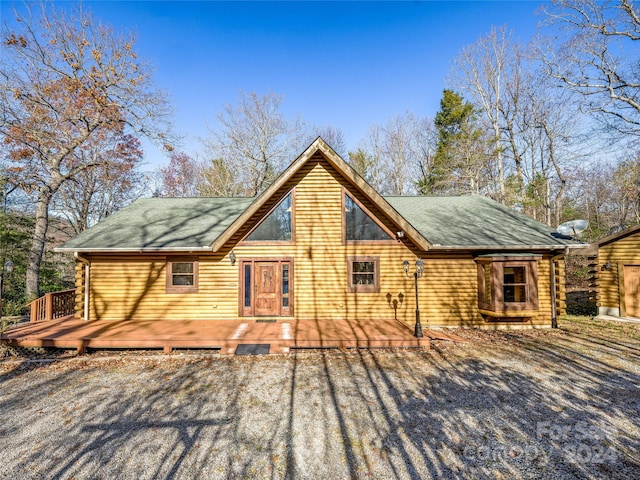 back of house featuring a deck